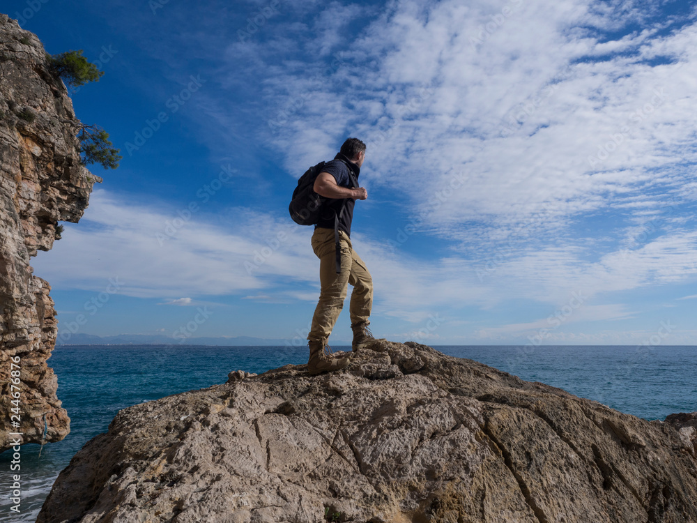 a man enjoys the summer view on top of Mount. Travel concept.