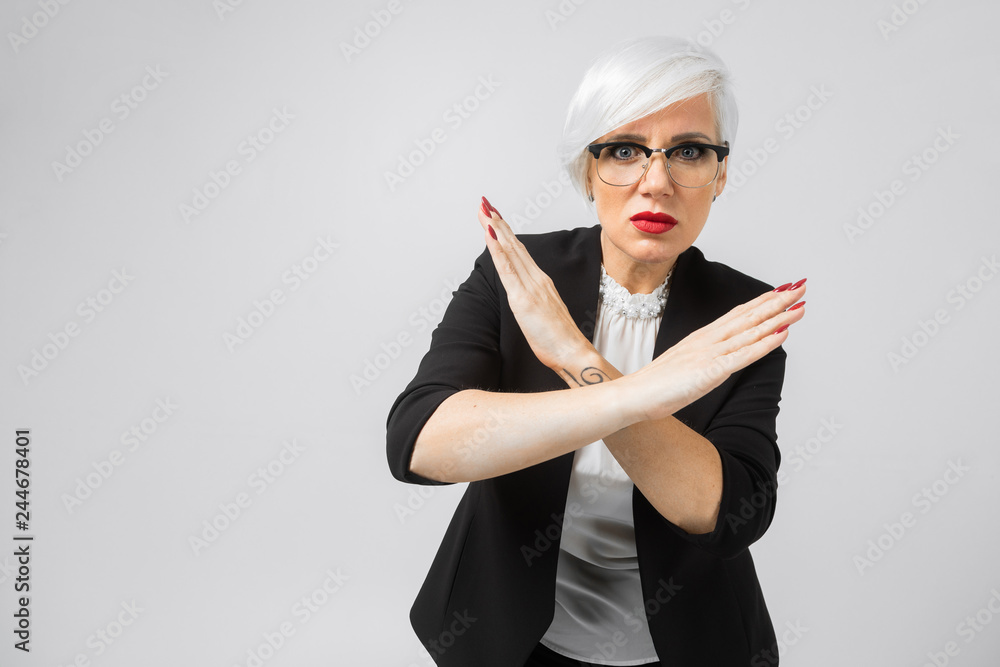 Young blonde holds two arms crossed isolated on white background Young blonde holds two arms crossed isolated on white background