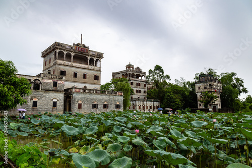 July 2017 – Kaiping, China - Kaiping Diaolou and lotus pond in Zili Village, near Guangzhou. Built by rich overseas Chinese, these family houses are a unique mix of Chinese and western architecture