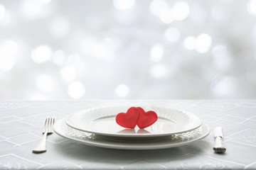 Valentines day table place setting with two hearts. Space for text. Invitation for a date.