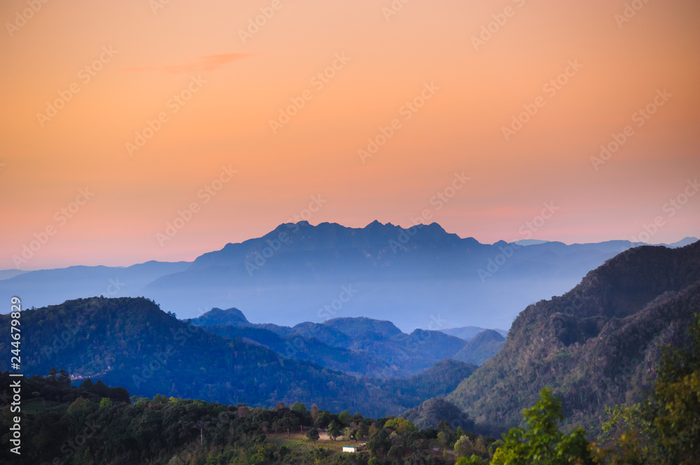 Beautiful mountains ranges with twilight sky in the early morning dawn ,tourist attraction at monson chiang mai province in thailand