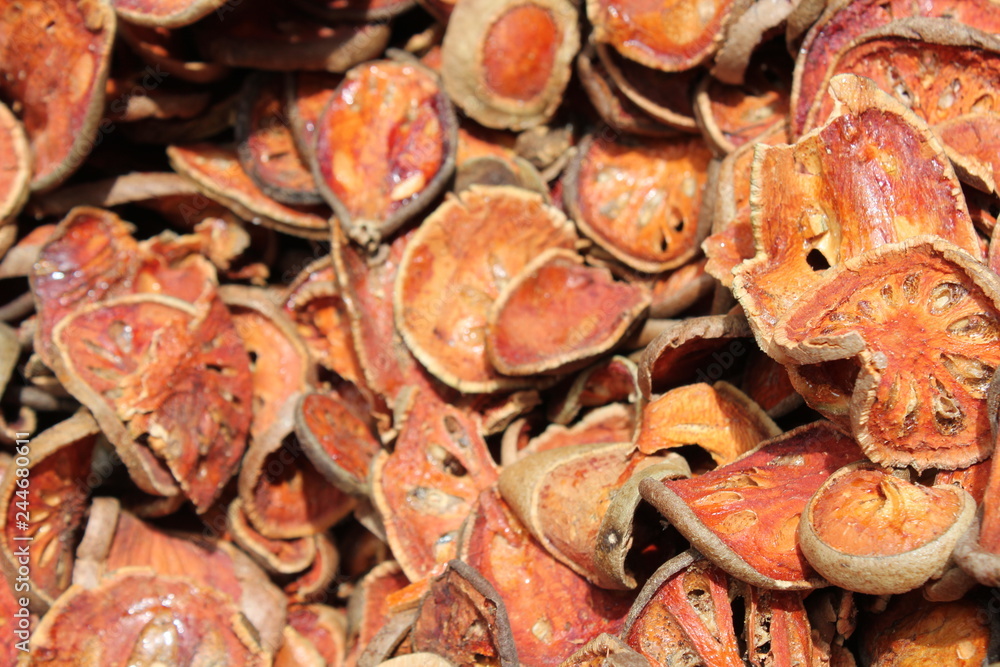 Dried bael fruit background. Close up dried herb. Many of slices of bael fruit . Dried bael fruit background. Close up dried herb. Many of slices of bael fruit .