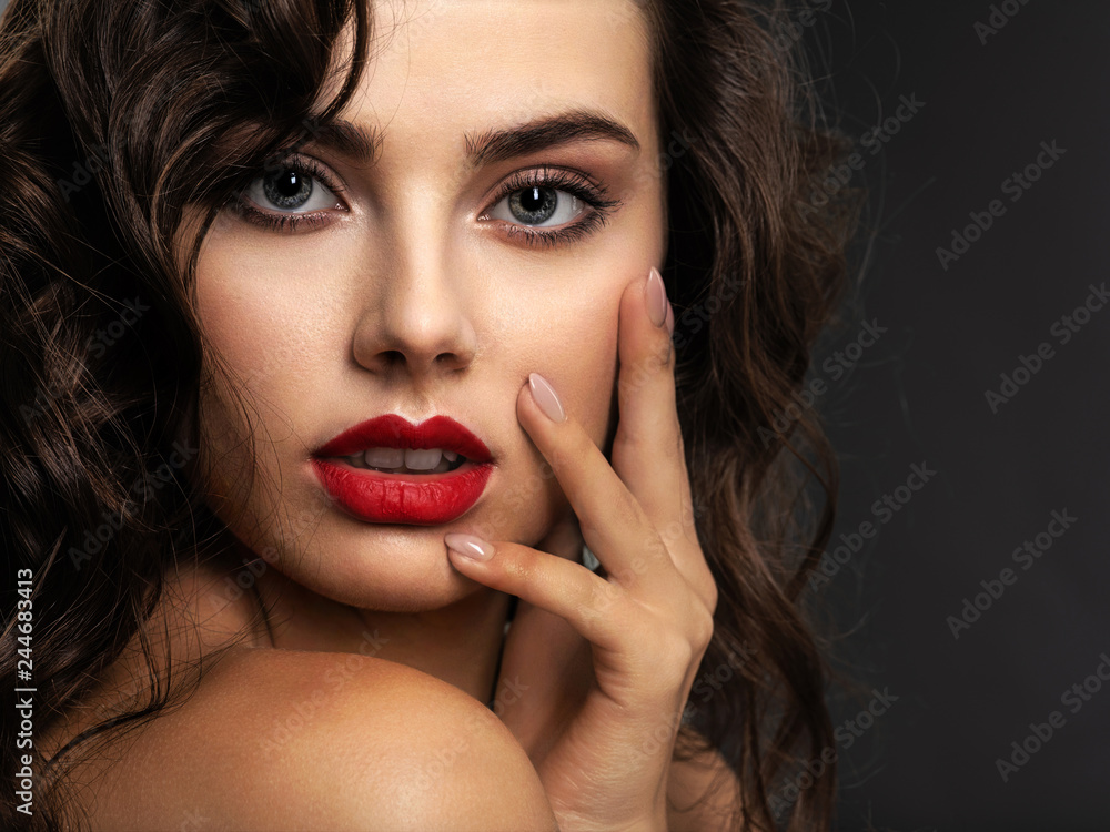 Face of a beautiful woman with a smoky eye makeup and red lipstick Face of a beautiful woman with a smoky eye makeup and red lipstick