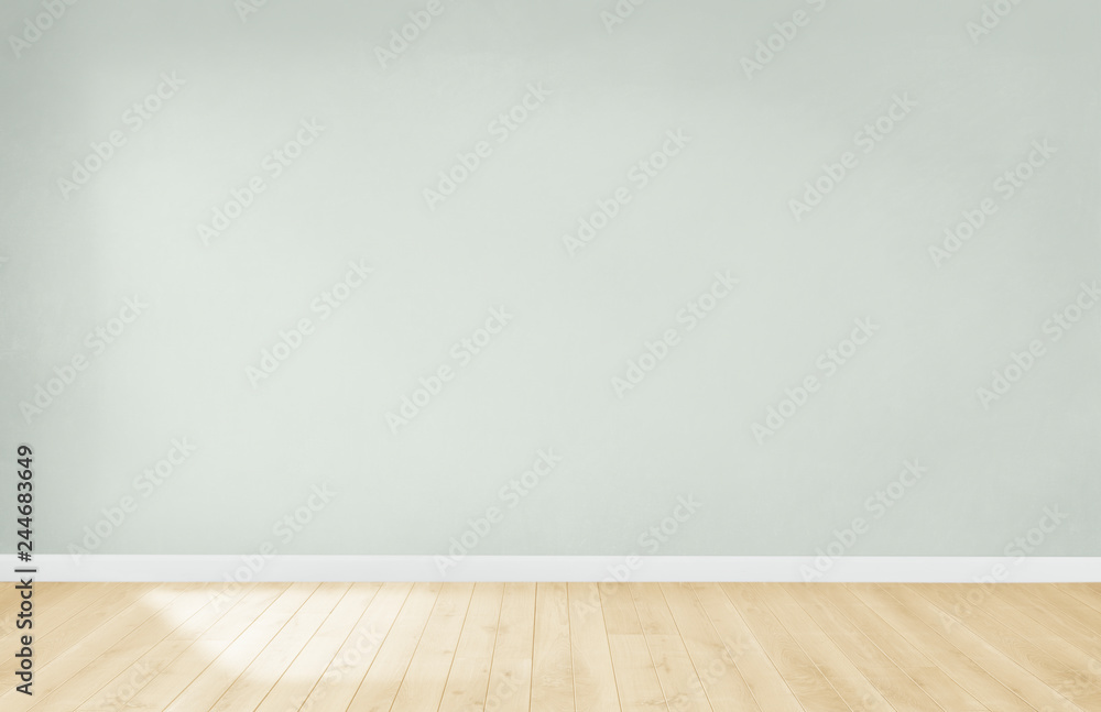 Light green wall in an empty room with a wooden floor - obrazy, fototapety, plakaty 