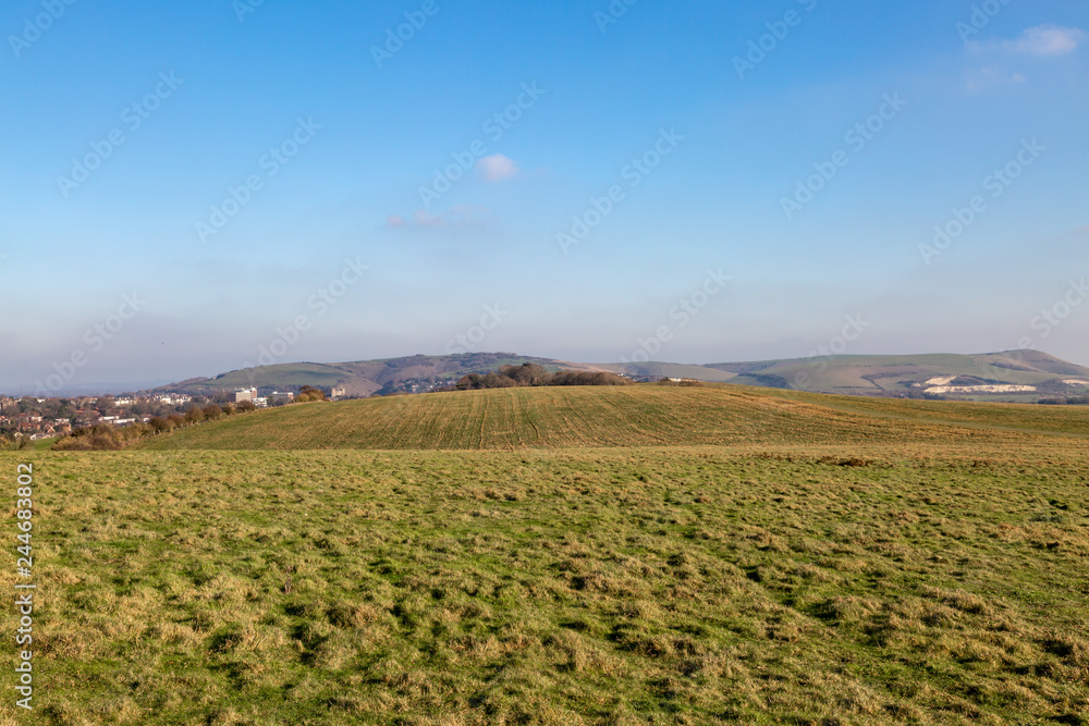 Looking out over the South Downs in Sussex, with the town of Lewes in the distance