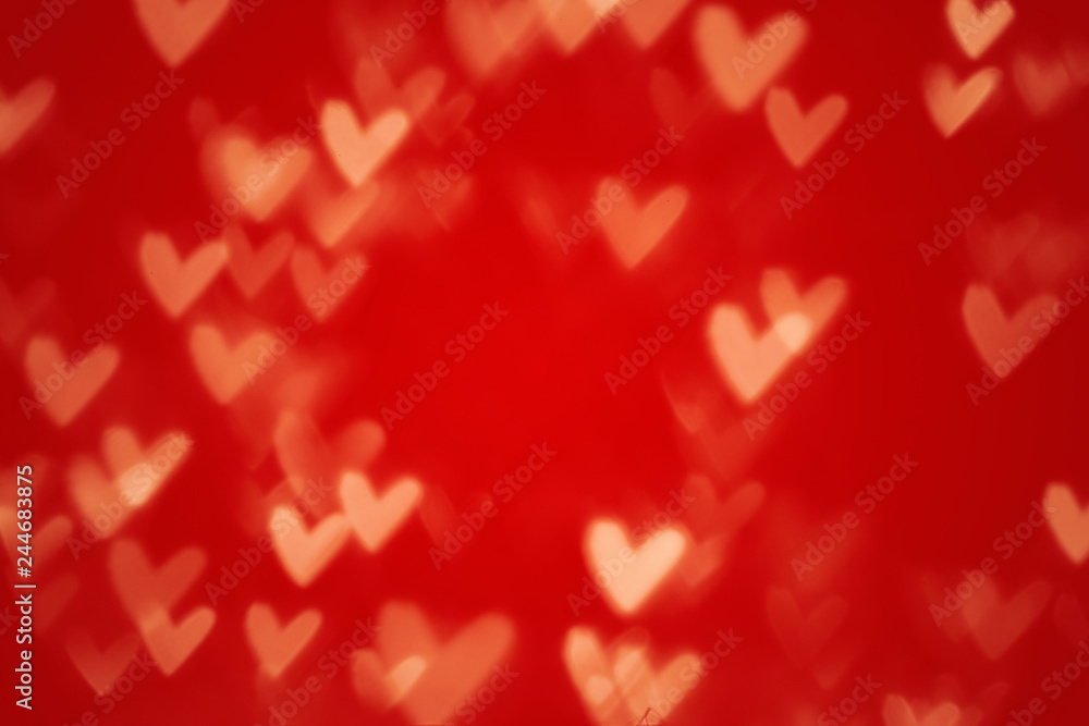 Valentine heart bokeh lights against a red background Valentine heart bokeh lights against a red background