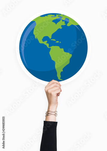 Hand holding a globe cardboard prop
