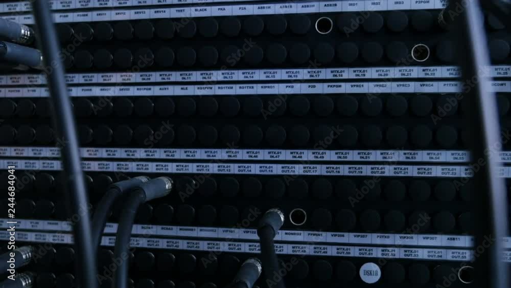 Close up of Cables and wiring links servers in a huge data center Close up of Cables and wiring links servers in a huge data center