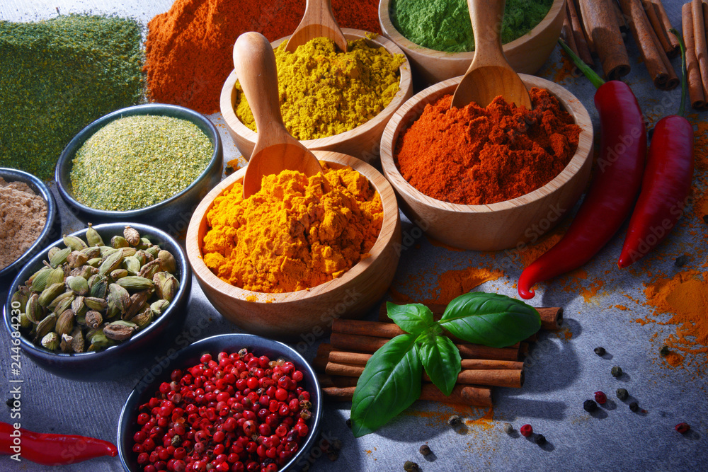 Variety of spices on kitchen table Variety of spices on kitchen table