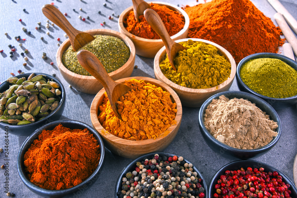 Variety of spices on kitchen table Variety of spices on kitchen table