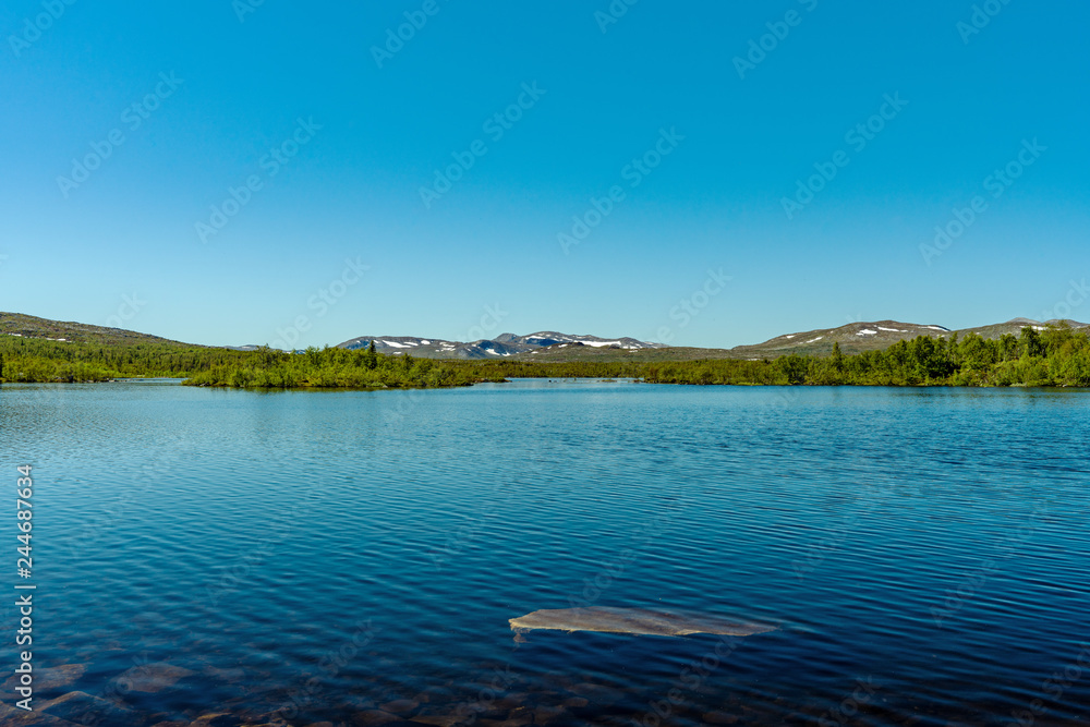 View cross a lake in the Swedish highlands