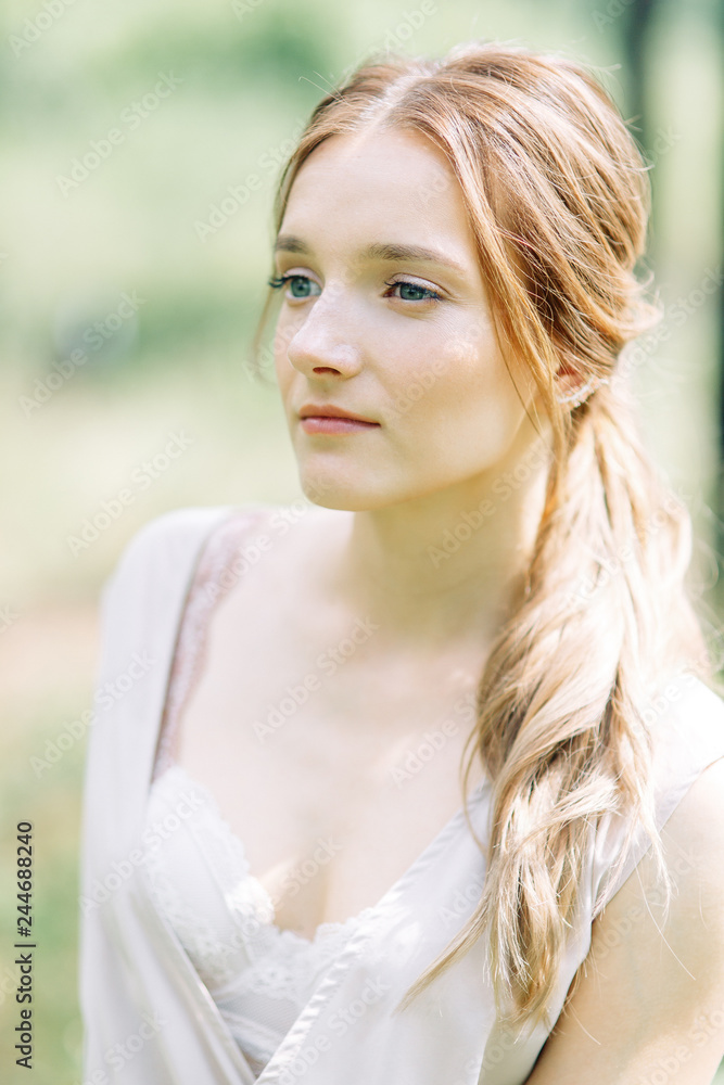 Boudoir photo shoot of the bride in the woods with a bouquet. Flying dress and beautiful girl in the Park. Boudoir photo shoot of the bride in the woods with a bouquet. Flying dress and beautiful girl in the Park.