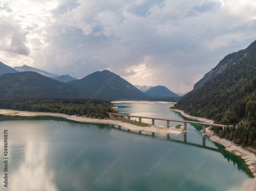 Amazing bridge over accumulation lake Sylvenstein, upper Bavaria. Aerial view. September, 2018 Amazing bridge over accumulation lake Sylvenstein, upper Bavaria. Aerial view. September, 2018