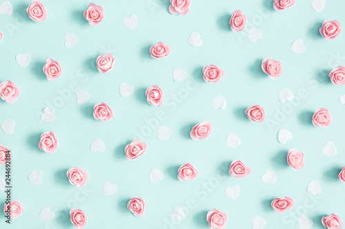 Flowers composition. Pink rose flowers on pastel blue background. Valentines day, mothers day, womens day concept. Flat lay, top view