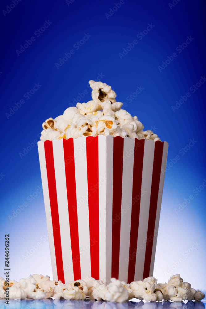 Red movie popcorn box with blue background