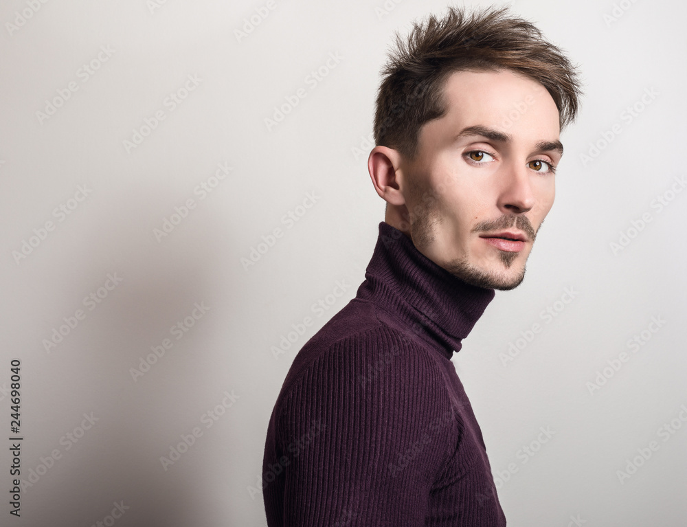 Handsome young elegant man in violet golf. Handsome young elegant man in violet golf.