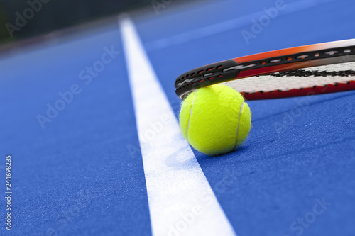 Tennis ball and racket