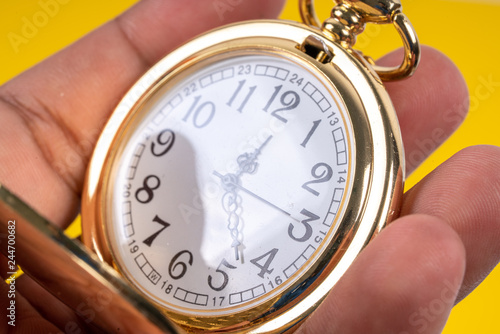 Pocket watch with close up view.