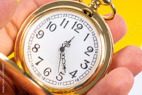 Pocket watch with close up view.