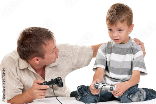 Dad and Son holding Joysticks and Playing Video Games on console together. Family - Father and upset Boy gaming on white background. Man with Child playing Computer Game.