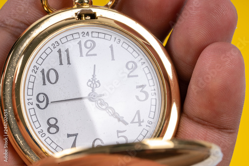 Pocket watch with close up view.
