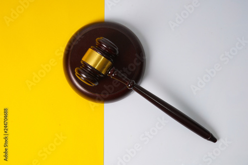 Gavel hammer with yellow background