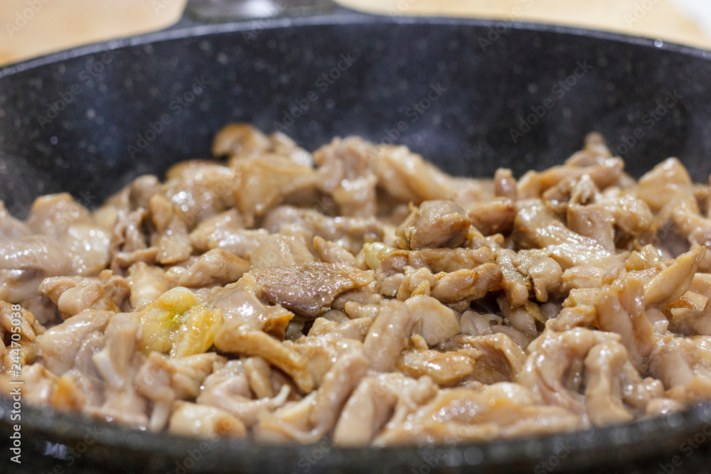 The process of frying chicken fillet in a pan The process of frying chicken fillet in a pan
