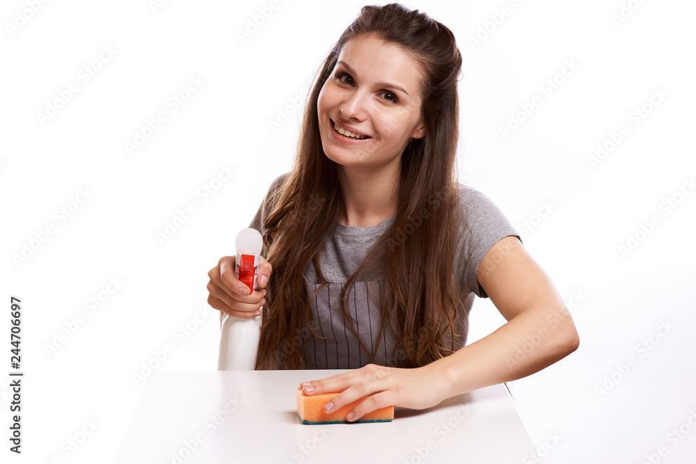 Beautiful young woman makes cleaning the house. Girl rubs dust. Beautiful young woman makes cleaning the house. Girl rubs dust.