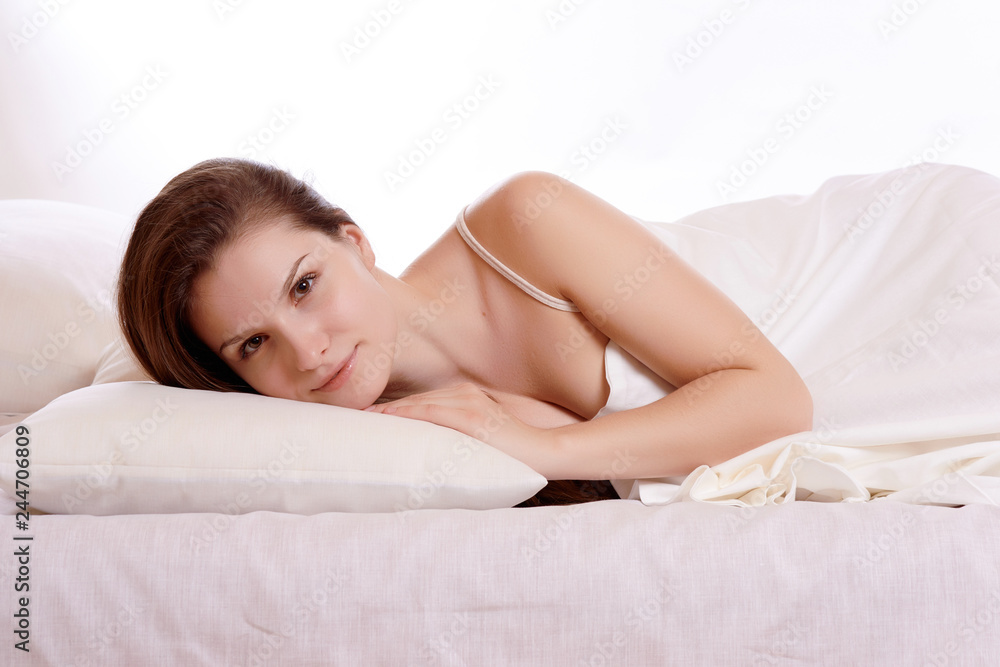 Young beautiful woman sleeping in her bed and relaxing in the morning Young beautiful woman sleeping in her bed and relaxing in the morning