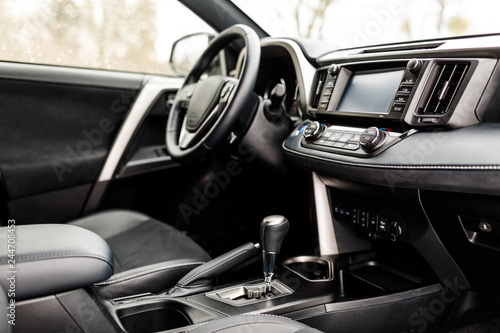 Luxury prestige car interior, dashboard, steering wheel.