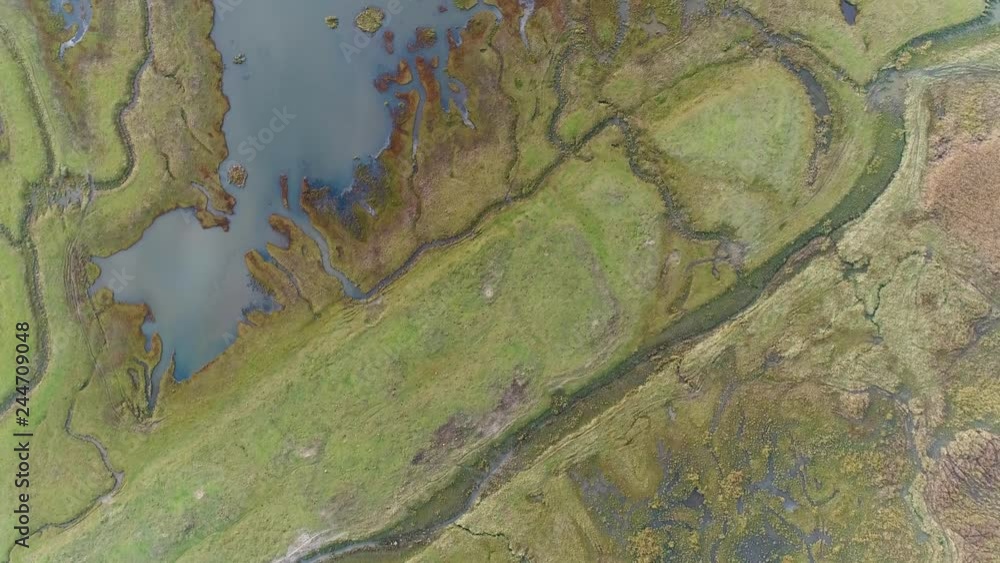 Aerial view of lake water connecting with wetland field, Netherlands. Aerial view of lake water connecting with wetland field, Netherlands.