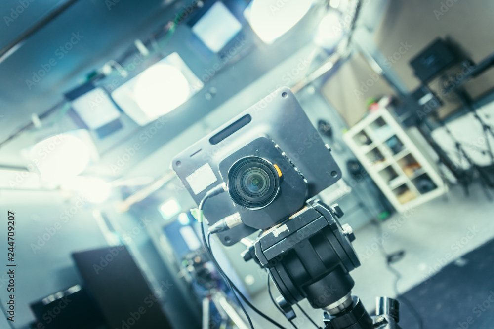 Fototapeta premium Film camera in broadcasting studio, spotlights and other equipment