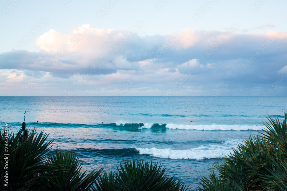 beach and tropical sea with surfer