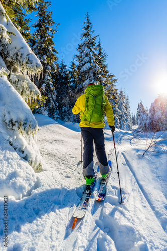 Ski in Beskidy mountains. The skituring man, backcountry skiing in fresh powder snow. photo