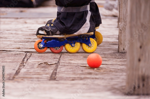 Photography hocky players skates while he is standing befine the bench