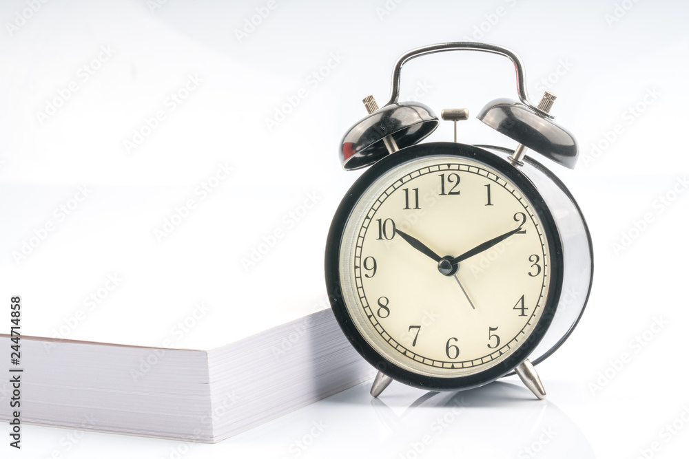 Clock and book with white background. Clock and book with white background.