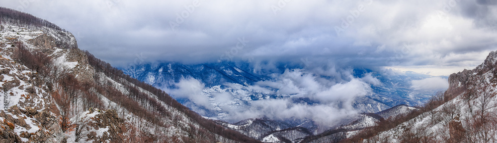 Winter mountains panorama with dynamic clouds. Aerial panorama landscape of Dry mountain, Serbia
