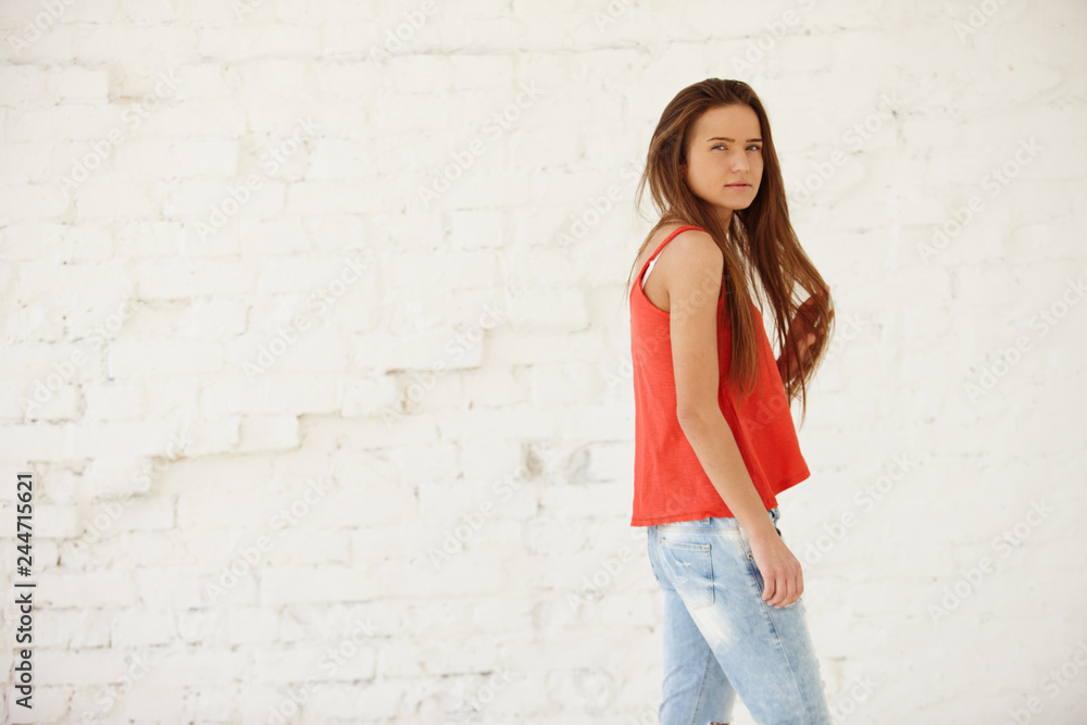 Cute girl posing in the loft studio