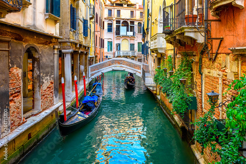 Canvas Print Narrow canal with gondola and bridge in Venice, Italy