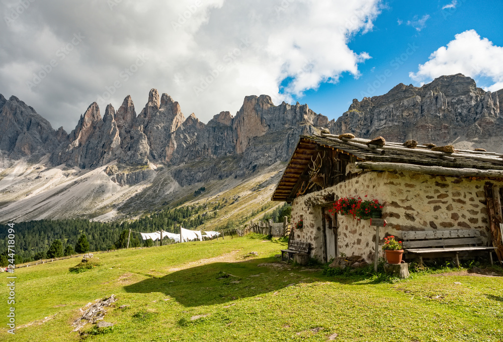 Beautiful mountain landscape of rifugio Brogles in Dolomites Italy. Tranquil hutte on top of mountain