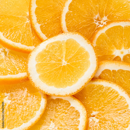 Sliced oranges background, bright fresh fruit cut into even slices