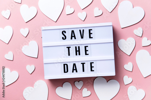 Save the date lightbox message with white hearts on a pink background