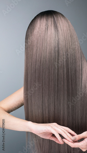 Pattern of deep purple hair color. Strong and shiny hair after salon dyeing.