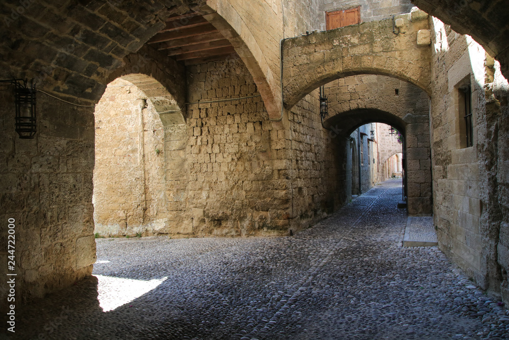 Medieval arched street in the town of Rhodes