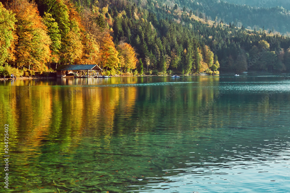 Beautiful blue mountain lake on a warm fall season day