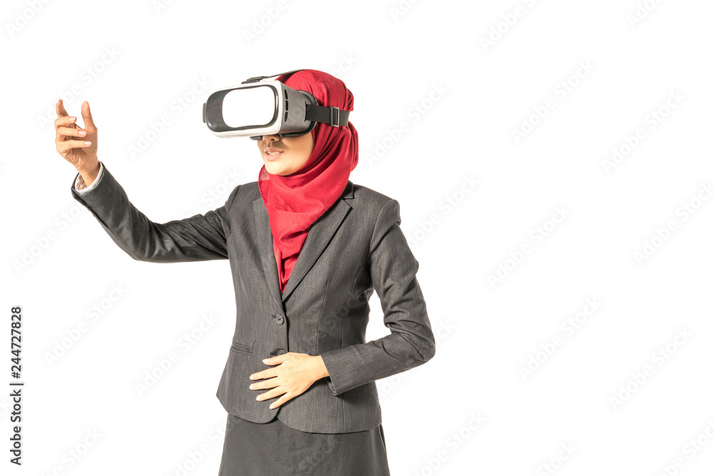 Veiled businesswoman wearing vr (Virtual Reality) box with white background. Technology conceptual. Veiled businesswoman wearing vr (Virtual Reality) box with white background. Technology conceptual.
