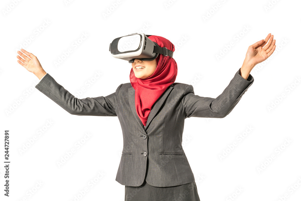 Veiled businesswoman wearing vr (Virtual Reality) box with white background. Technology conceptual. Veiled businesswoman wearing vr (Virtual Reality) box with white background. Technology conceptual.