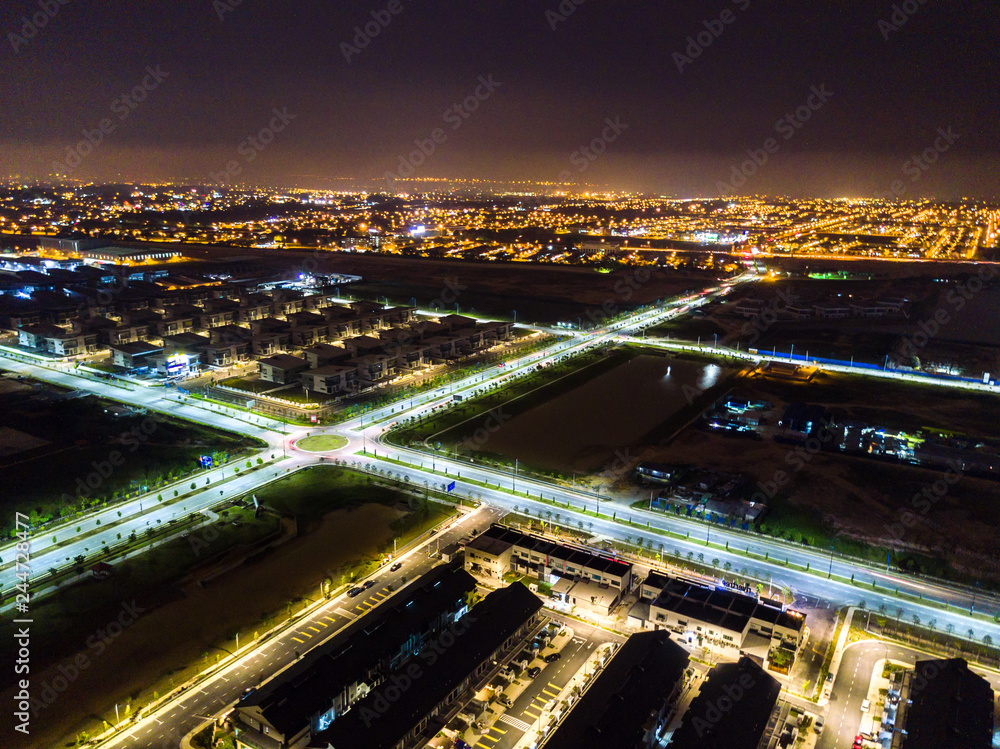 Aerial view of residential houses in night light.