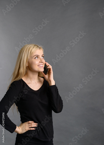 Nice pretty blonde happy smiling girl talking on the phone