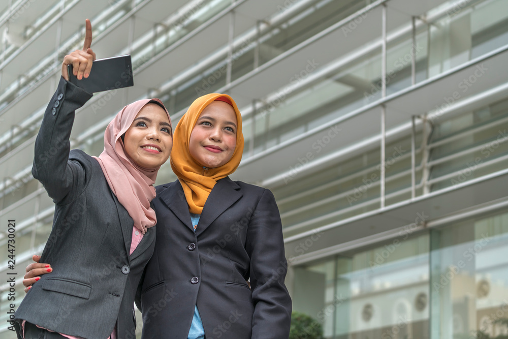 Beautiful modern Muslim businesswoman portrait in office Beautiful modern Muslim businesswoman portrait in office